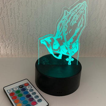Socle lumineux mains prière